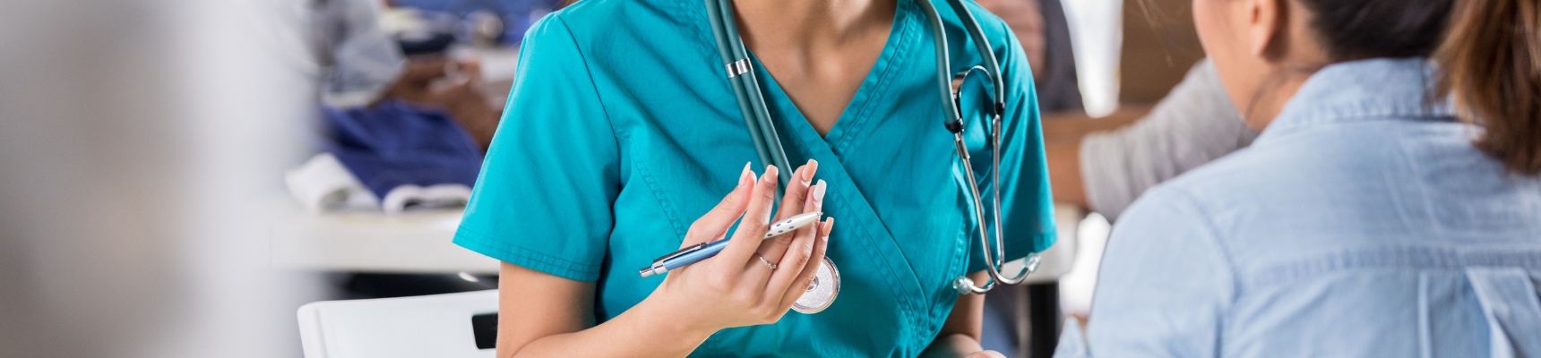 Close up of nurse talking to a patient